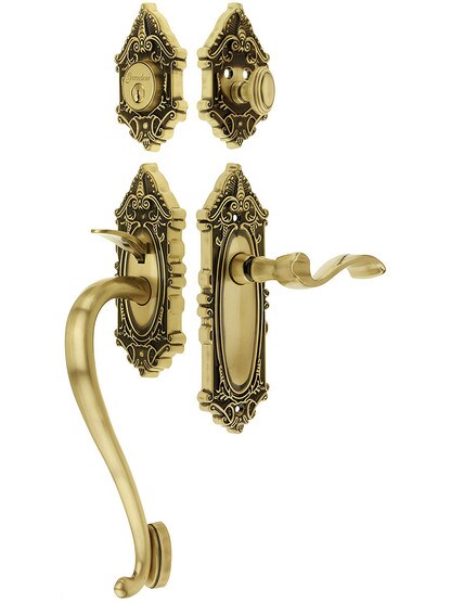 Grandeur Grande Victorian Thumblatch Entrance Set With Portofino Lever - Left-Handed in Antique Brass.